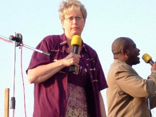 Julie preaching with an interpreter