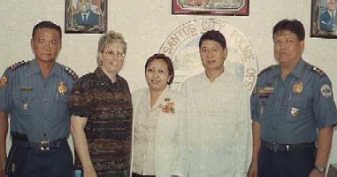 Julie with Mayor Acherone and police officers