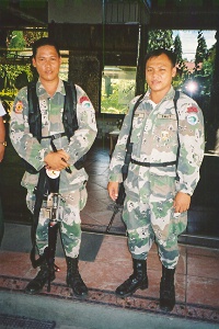 Two men from military police assigned to guard Julie & YMG Team.