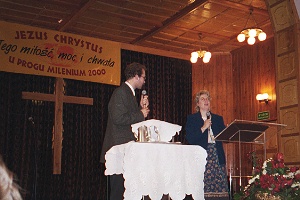 Julie preaching with interpreter in Poland