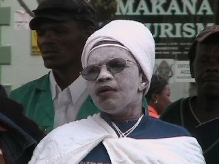 witchdoctor listening to the gospel