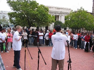 People on the street listen to the Gospel in the South Africa